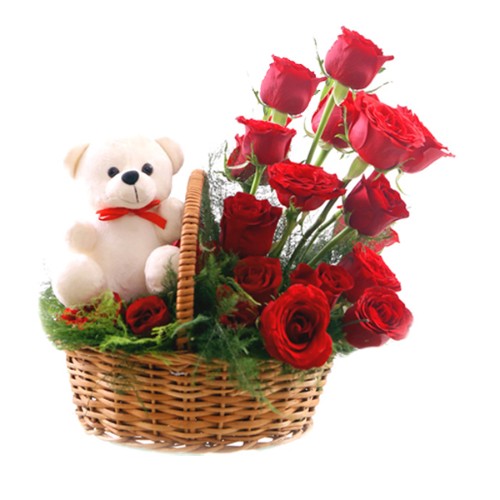 Cute Teddy sitting in a Red Roses Basket