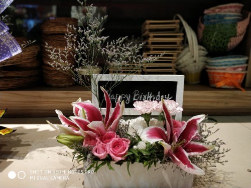 White and pink floral wooden arrangement