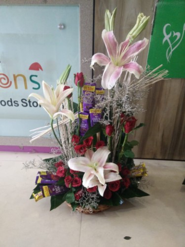 Lilies with roses and chocolates